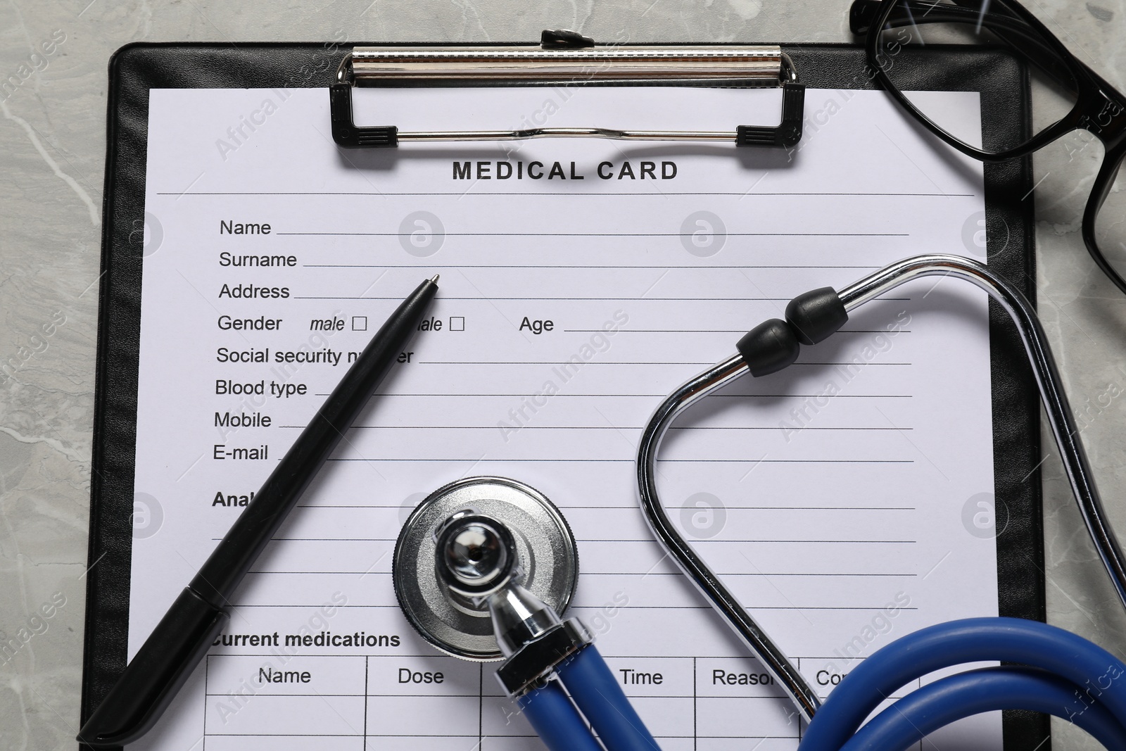 Photo of Flat lay composition with medical card form on grey background