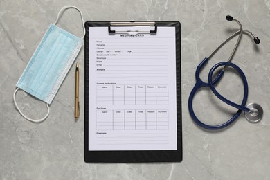 Flat lay composition with medical card form on grey background