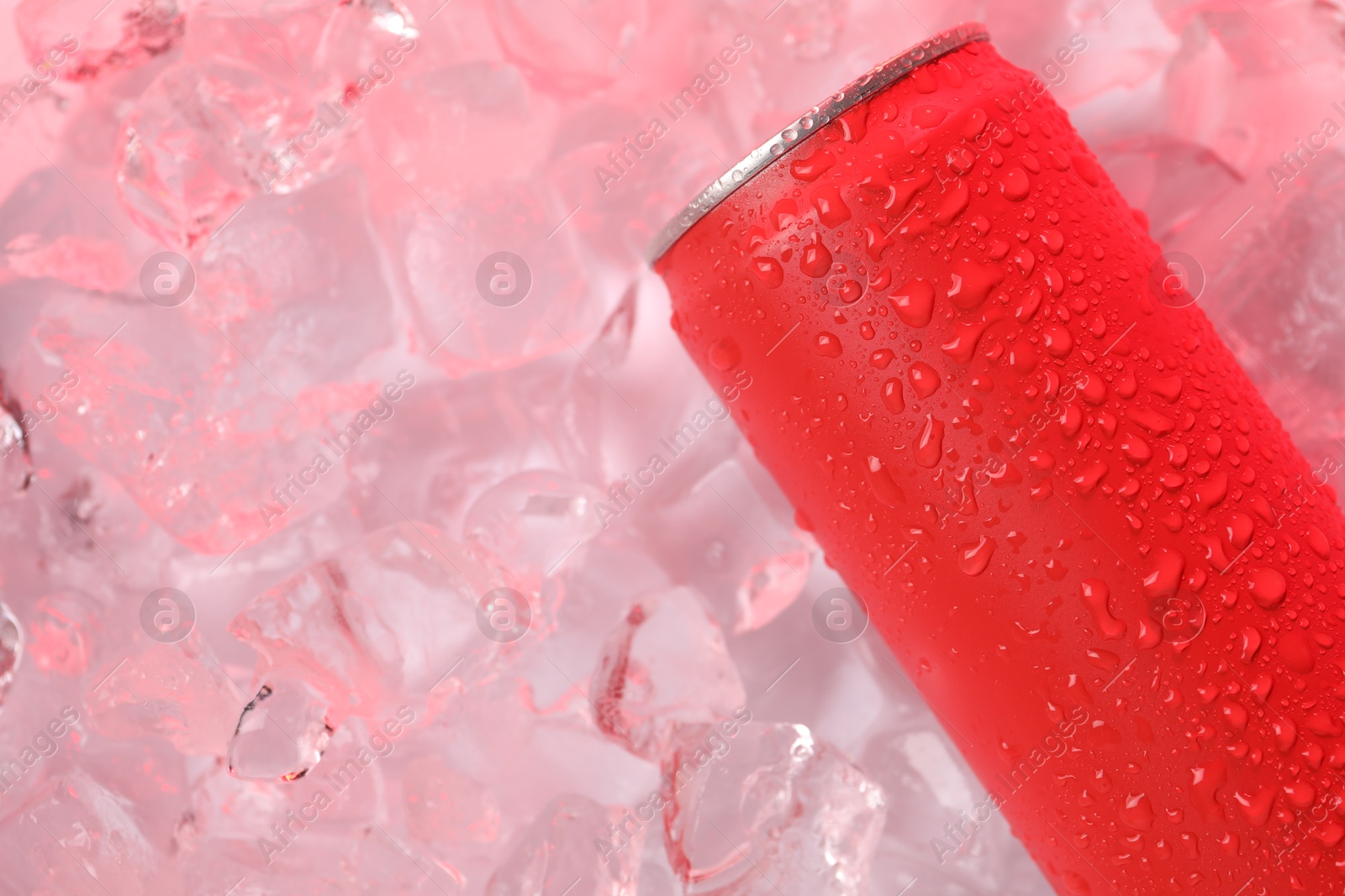 Refreshing drink in can on ice cubes, above view Photo of Refreshing drink in can on ice cubes, above view