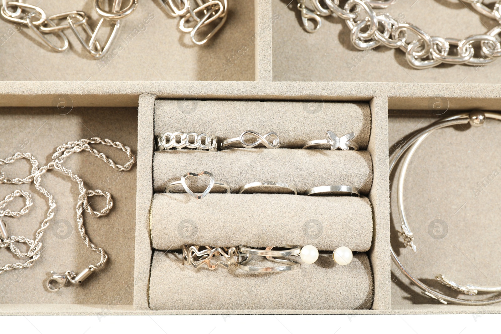 Many beautiful accessories in jewelry box, top view Photo of Many beautiful accessories in jewelry box, top view