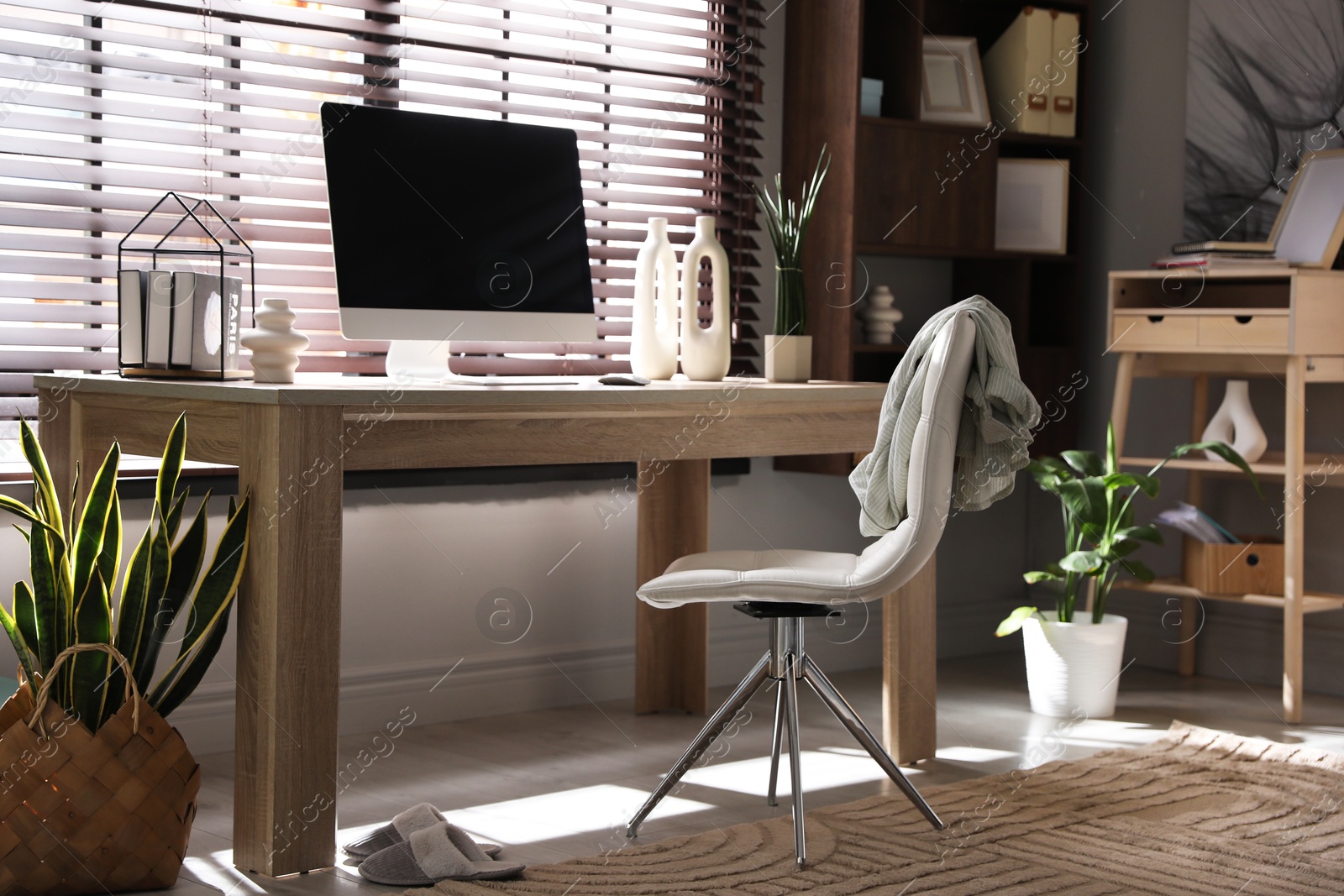 Photo of Comfortable workplace with computer in home office