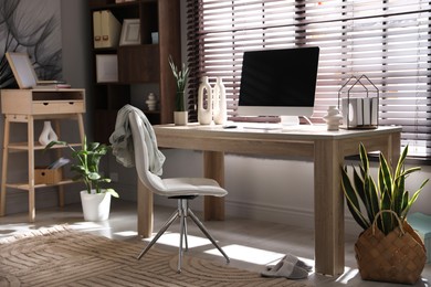 Comfortable workplace with computer in home office