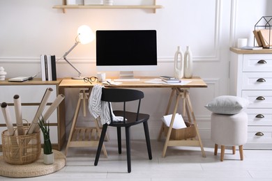 Photo of Comfortable workplace with computer in home office