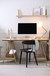 Photo of Comfortable workplace with computer in home office