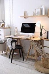 Photo of Comfortable workplace with computer in home office