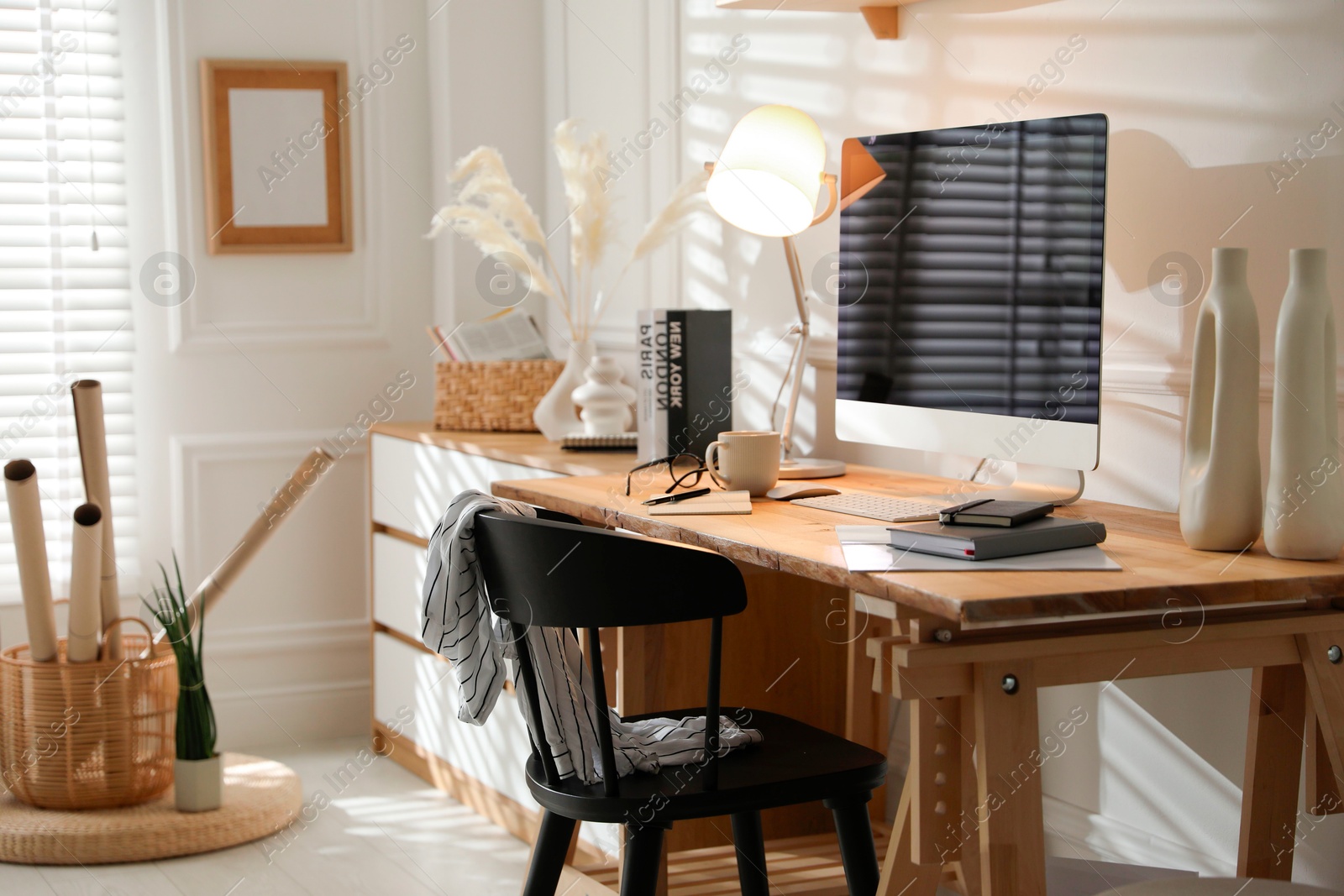 Photo of Comfortable workplace with computer in home office