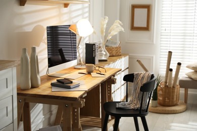 Photo of Comfortable workplace with computer in home office