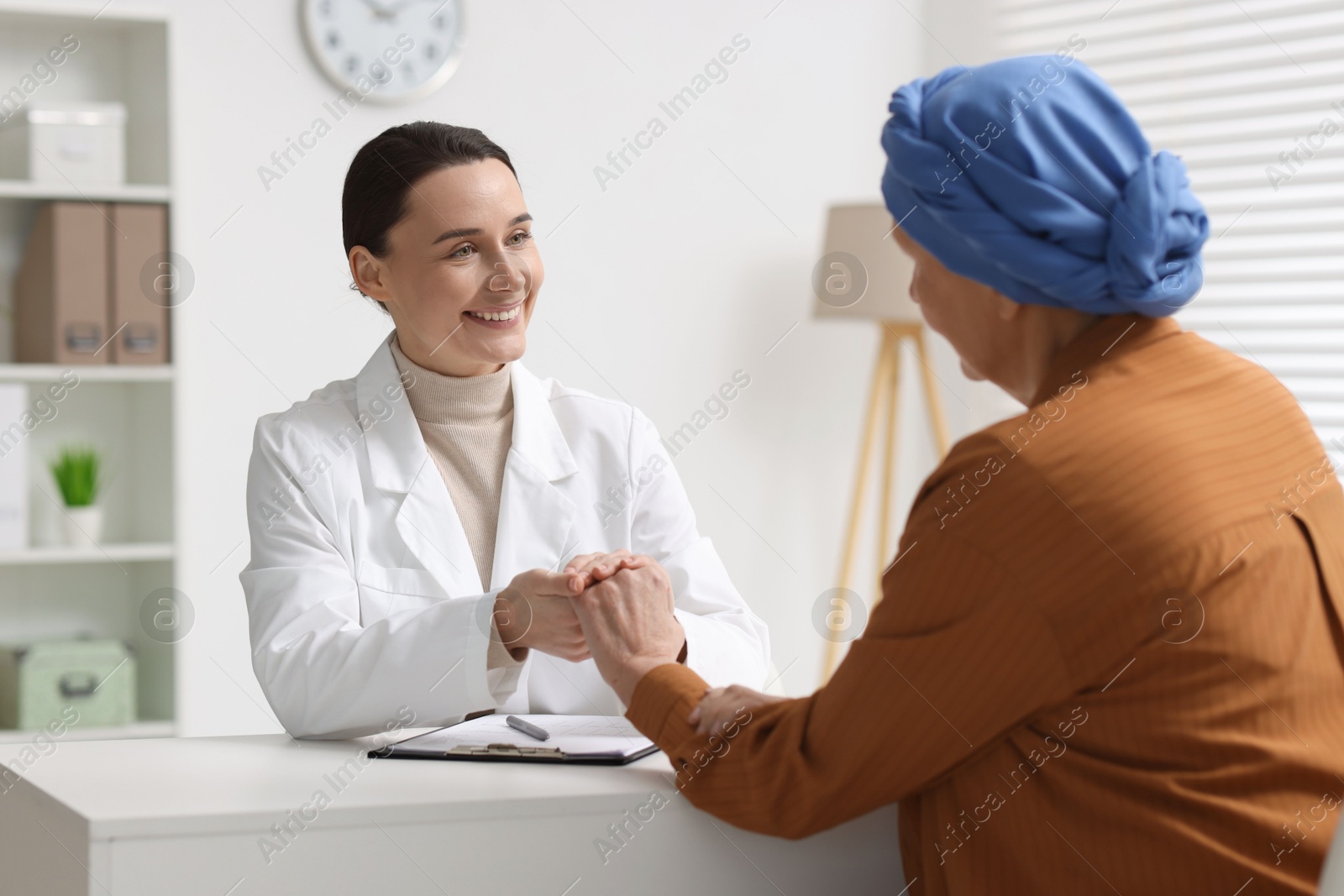 Photo of Senior woman with cancer visiting oncologist in clinic