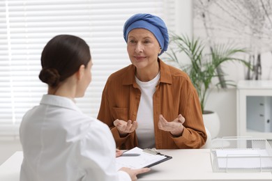 Senior woman with cancer visiting oncologist in clinic