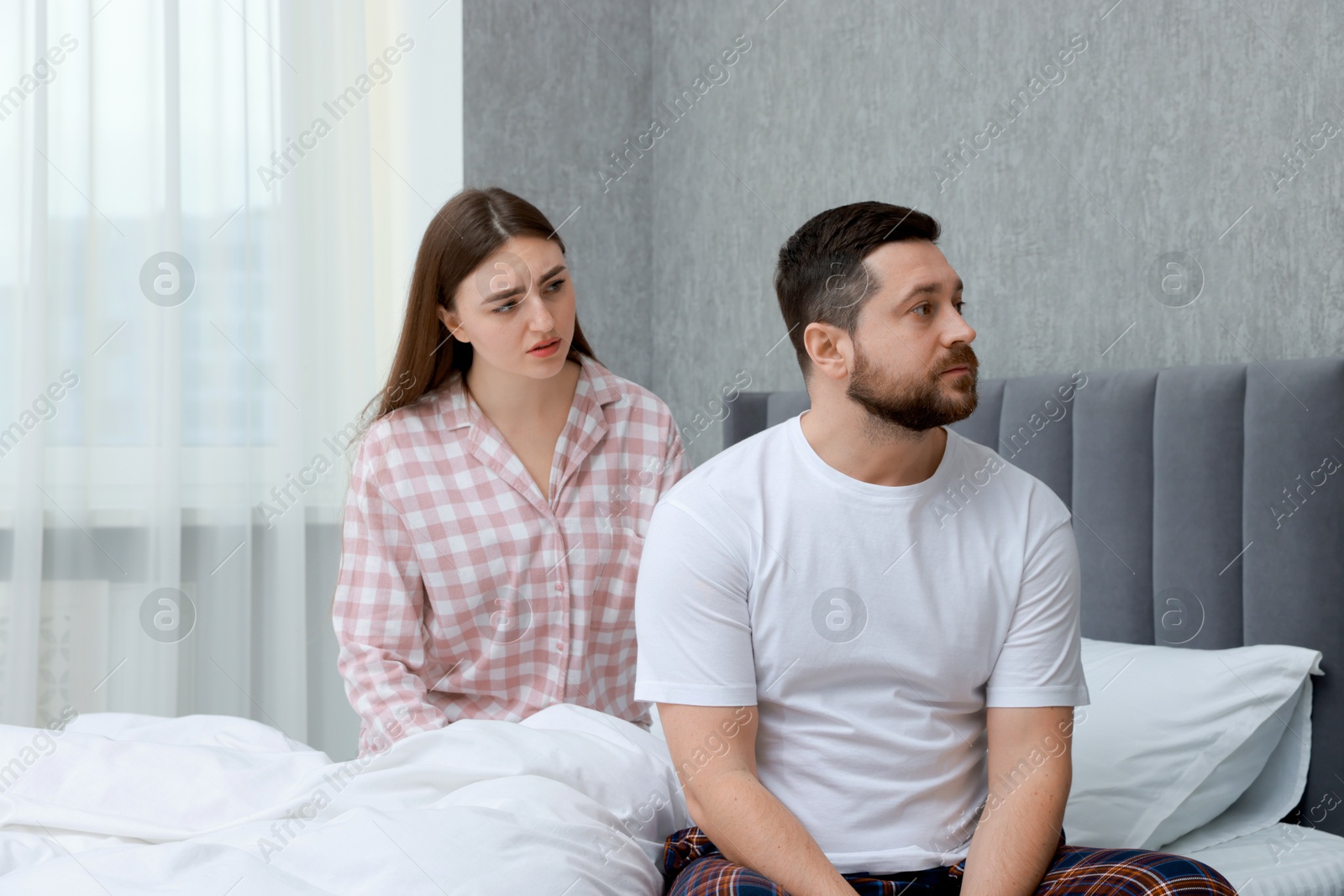 Photo of Resentful couple on bed at home. Relationship problem