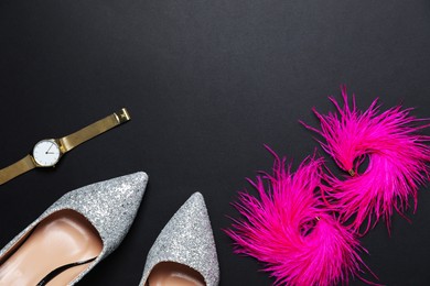 Beautiful shoes and stylish accessories on black background, flat lay. Space for text