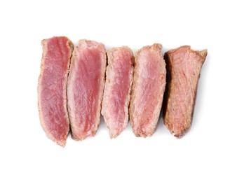 Photo of Delicious sliced beef tenderloin with different degrees of doneness isolated on white, top view