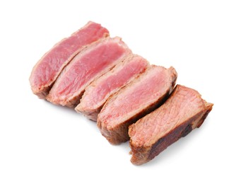 Photo of Delicious sliced beef tenderloin with different degrees of doneness isolated on white