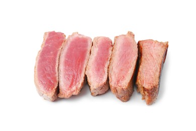 Photo of Delicious sliced beef tenderloin with different degrees of doneness isolated on white