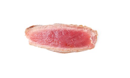 Photo of Slice of beef tenderloin cooked to rare isolated on white, top view