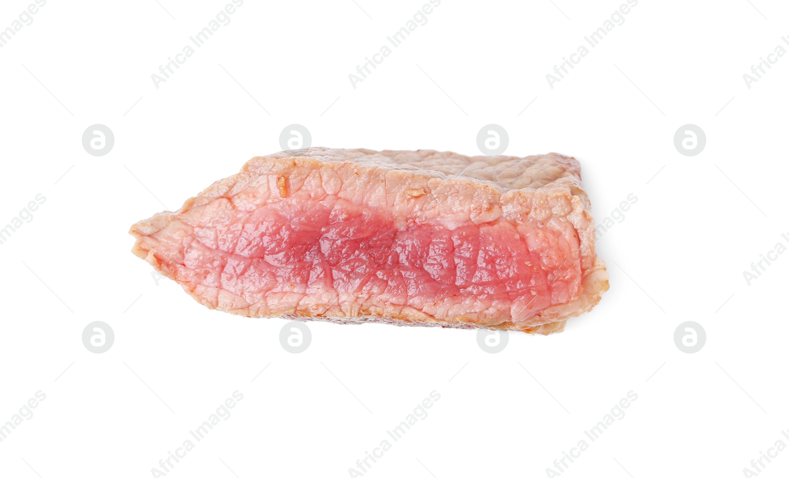 Photo of Slice of beef tenderloin cooked to medium rare isolated on white, top view