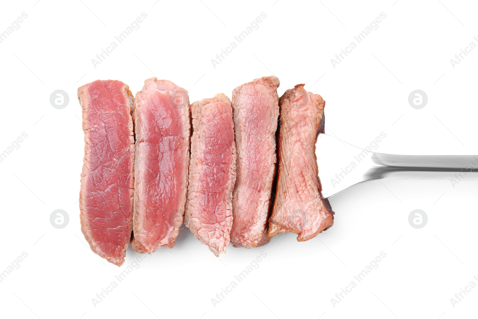 Photo of Delicious sliced beef tenderloin with different degrees of doneness isolated on white, top view