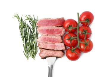 Photo of Delicious sliced beef tenderloin with different degrees of doneness, rosemary and tomatoes isolated on white, top view