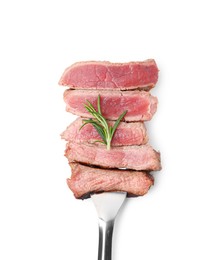 Photo of Delicious sliced beef tenderloin with different degrees of doneness and rosemary isolated on white, top view