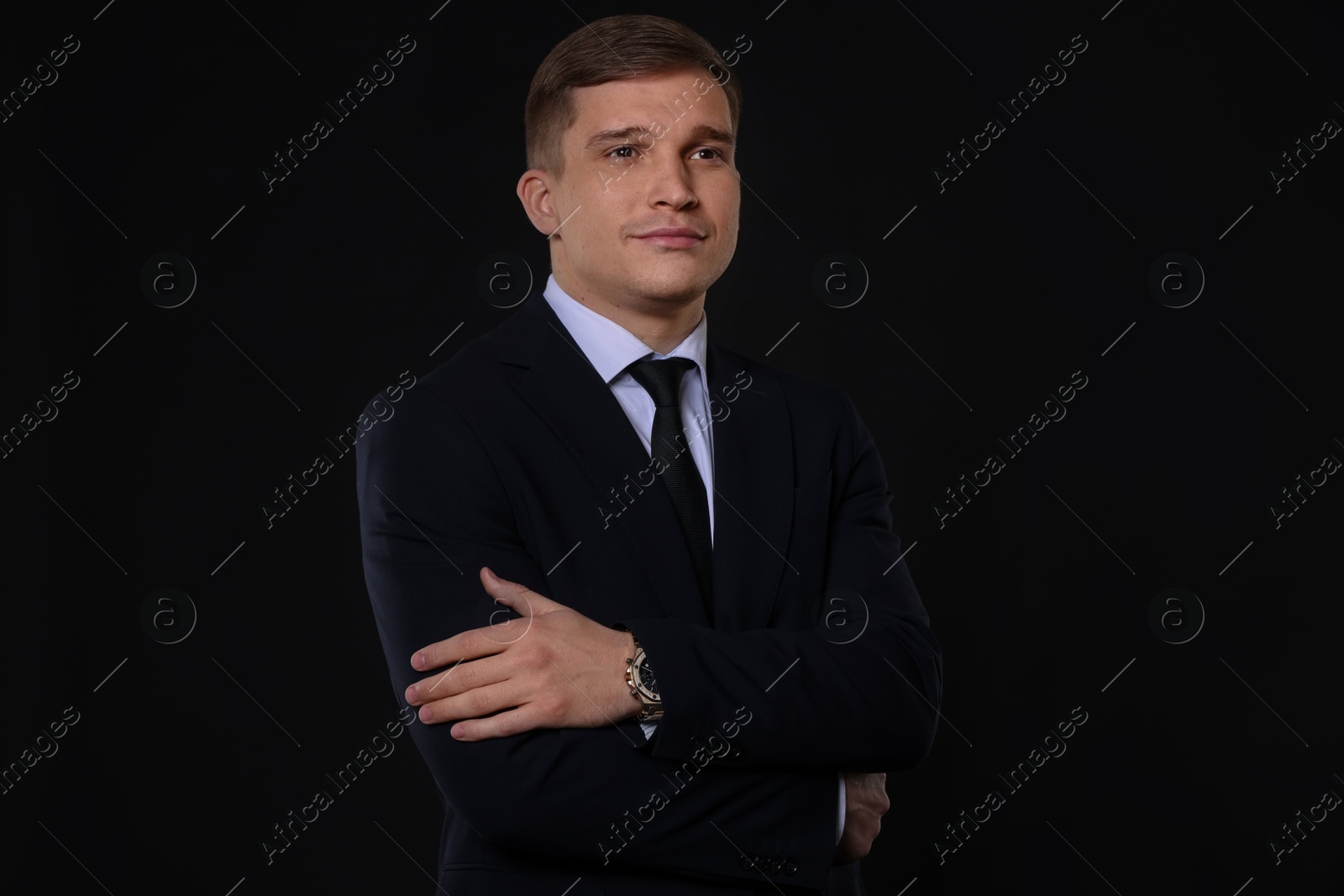 Photo of Man in classic suit on black background