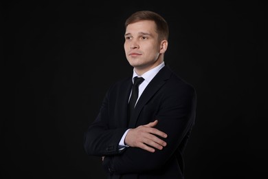 Photo of Man in classic suit on black background