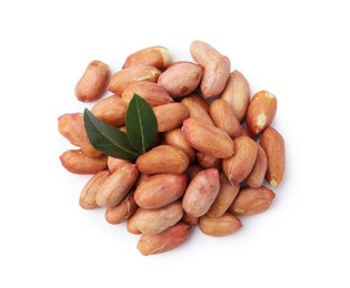 Photo of Pile of fresh peanuts isolated on white, top view