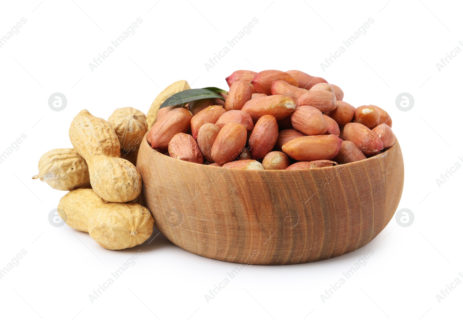 Fresh peanuts and bowl isolated on white Photo of Fresh peanuts and bowl isolated on white