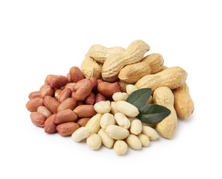 Photo of Pile of different peanuts and leaves isolated on white