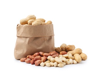 Photo of Fresh unpeeled peanuts in paper bag and peeled ones isolated on white