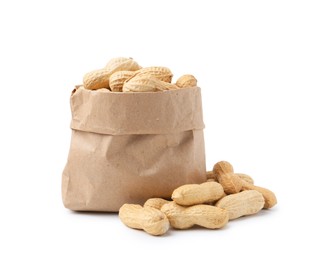 Photo of Unpeeled peanuts and paper bag isolated on white