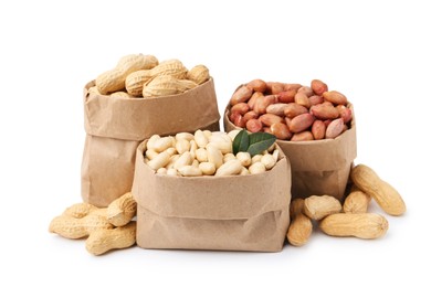 Photo of Different peanuts in paper bags isolated on white