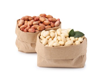 Photo of Fresh peanuts in paper bags isolated on white