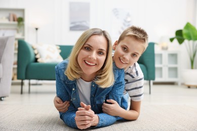 Photo of Mother and son on floor at home