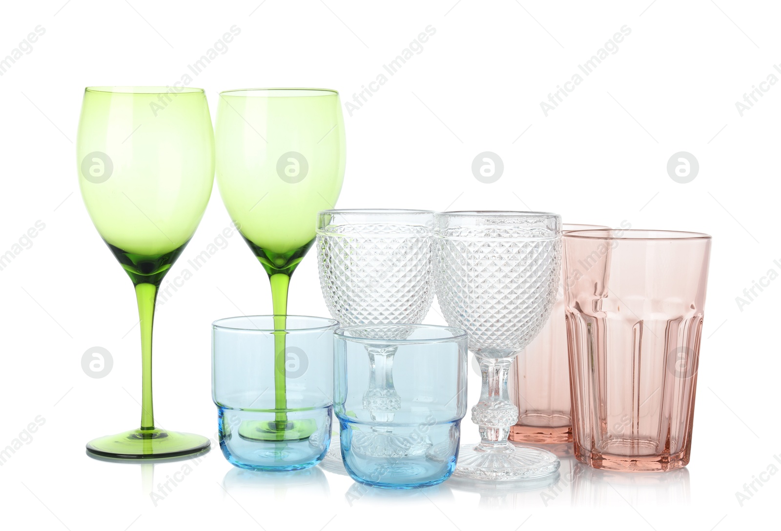 Photo of Many empty clean glasses isolated on white