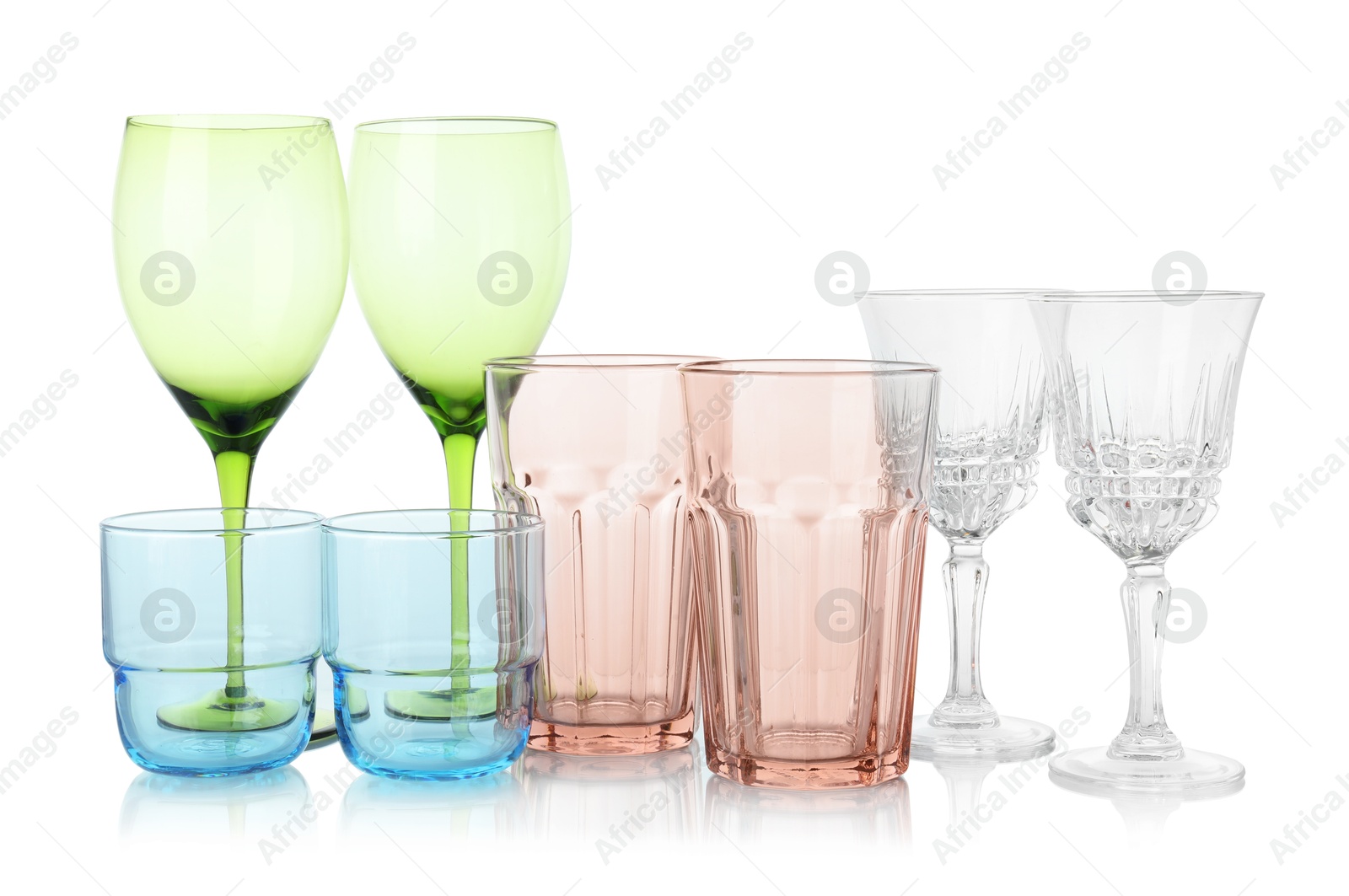 Photo of Many empty clean glasses isolated on white