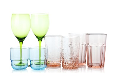 Photo of Many empty clean glasses isolated on white