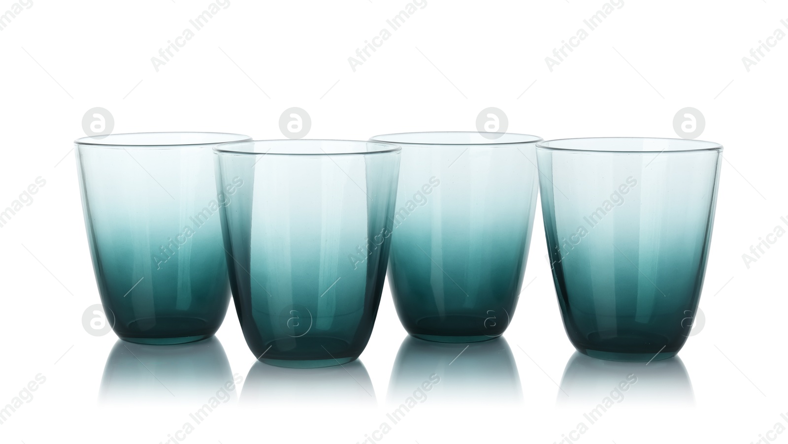 Photo of Many empty clean glasses isolated on white