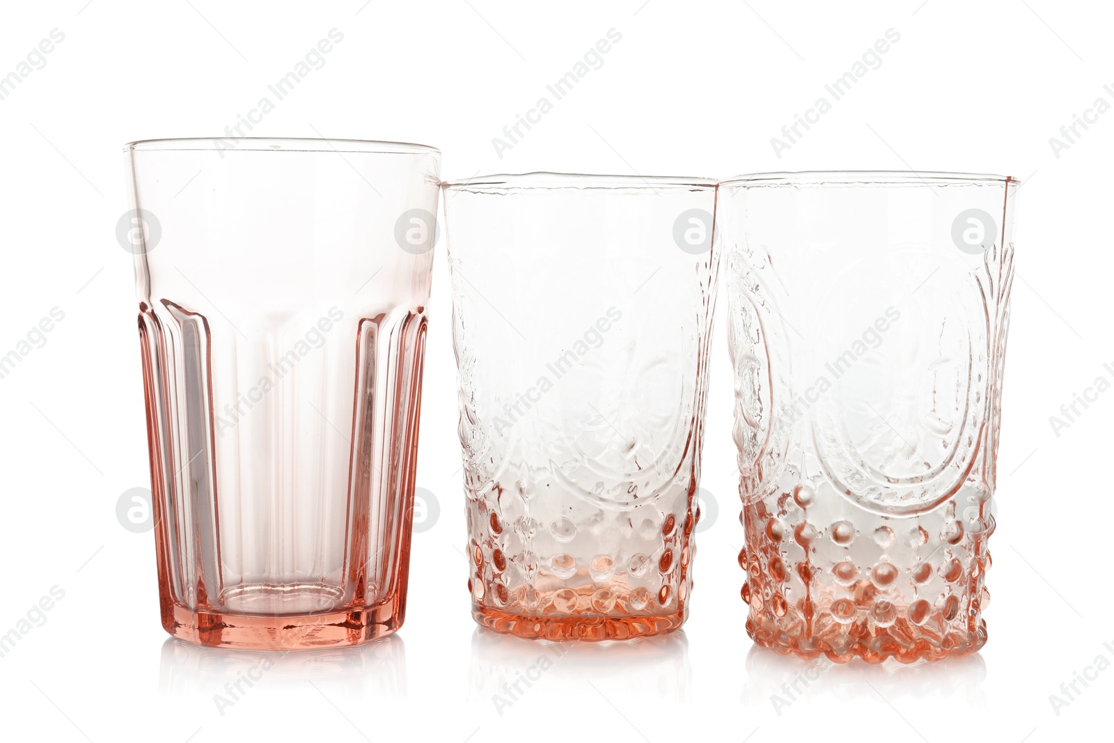 Photo of Three empty clean glasses isolated on white