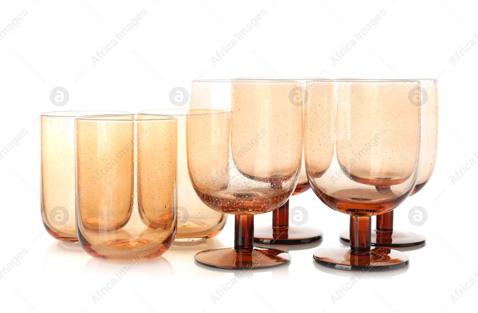 Photo of Many empty clean glasses isolated on white