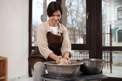 Hobby and craft. Woman making pottery indoors