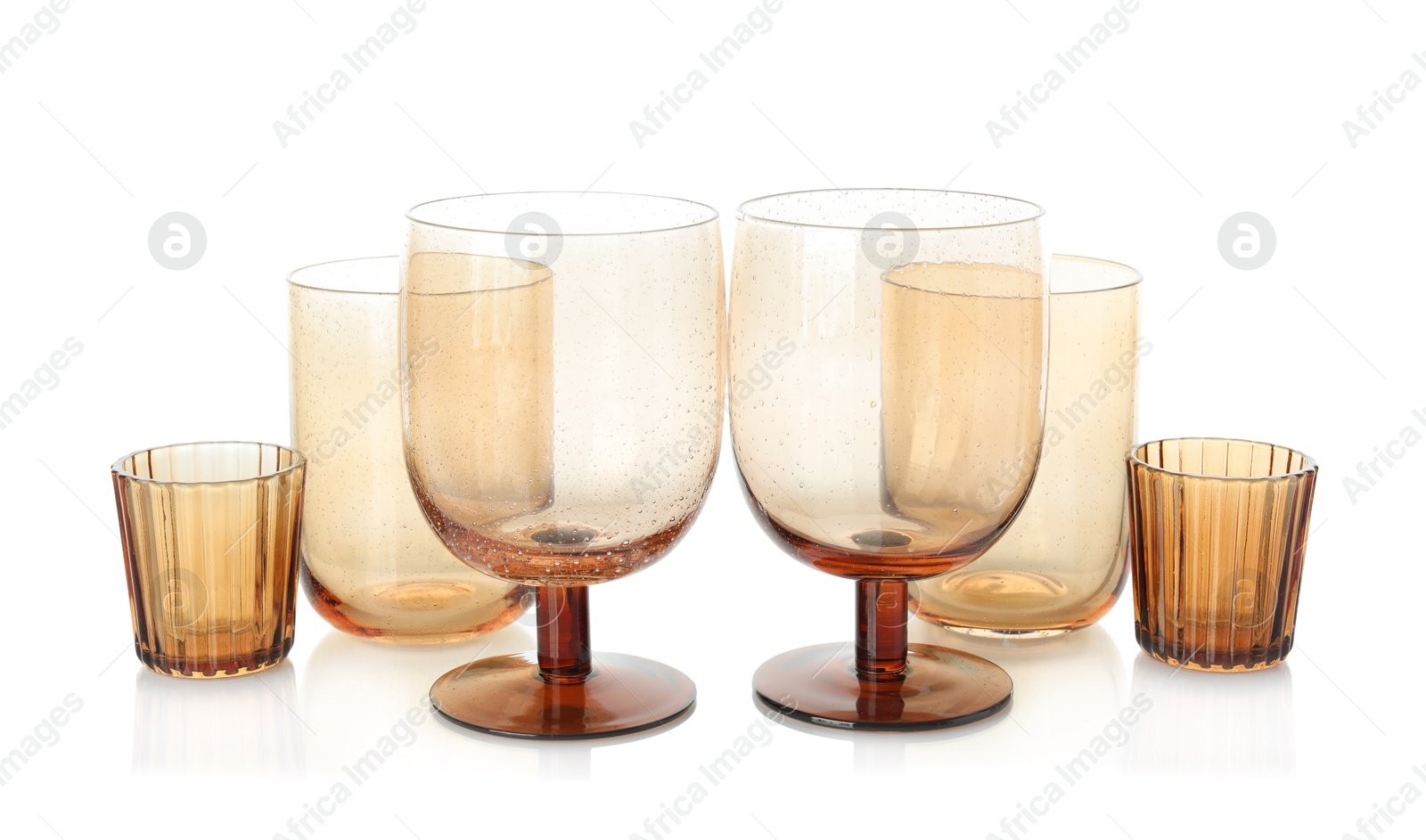 Photo of Many empty clean glasses isolated on white