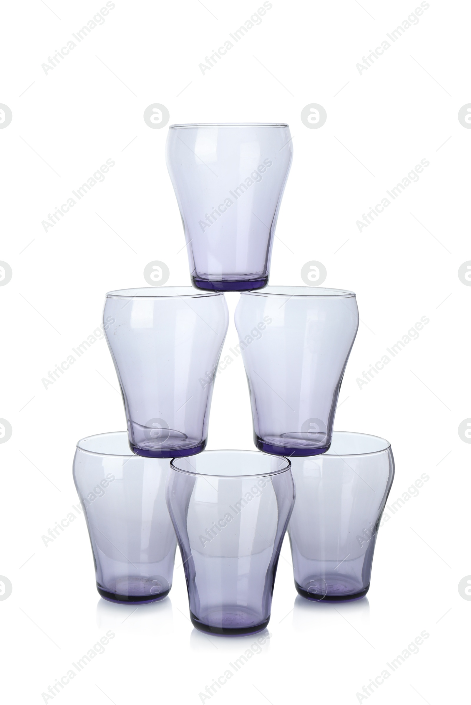 Photo of Many empty clean glasses isolated on white