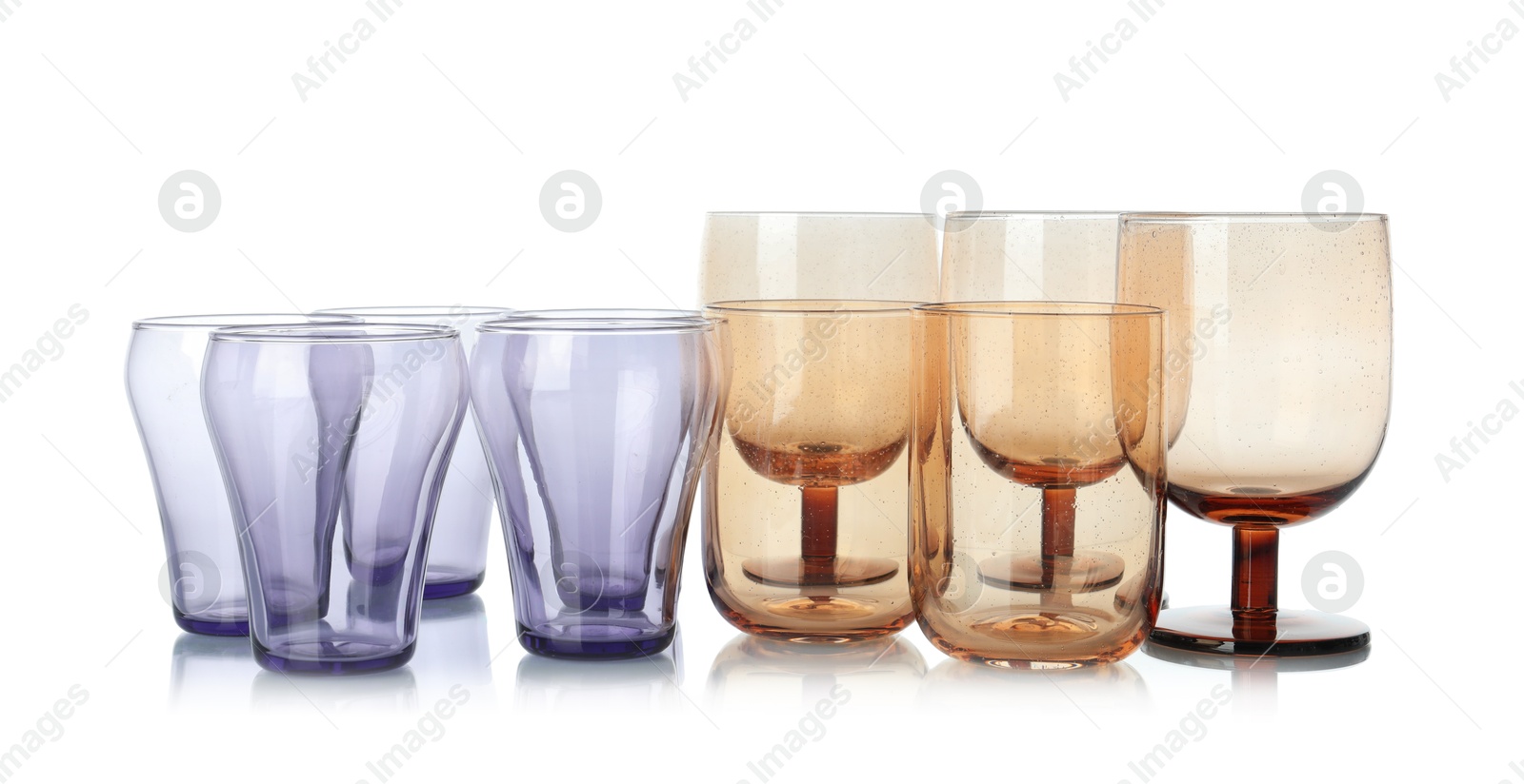 Photo of Many empty clean glasses isolated on white