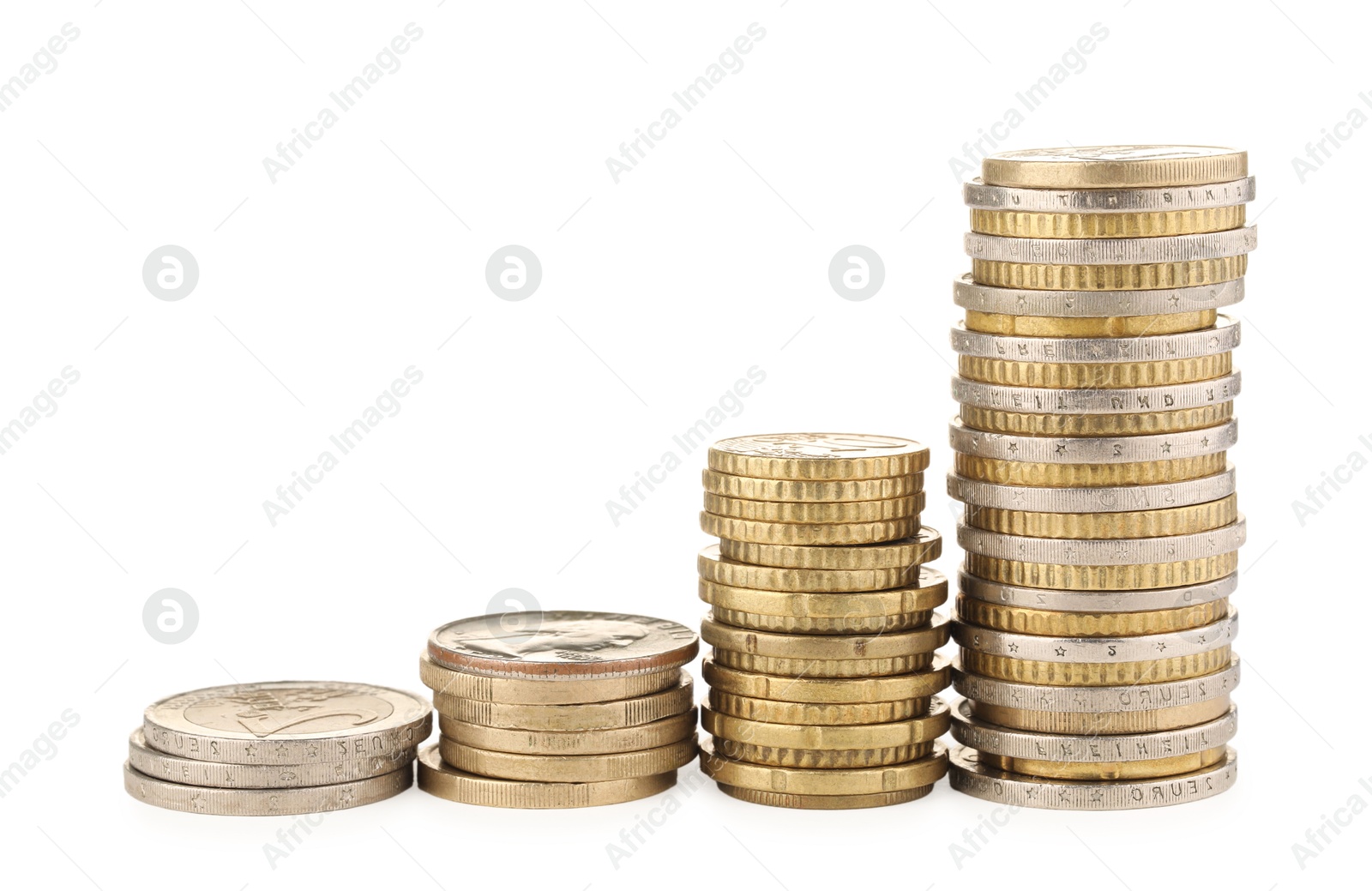 Photo of Stacks of different coins isolated on white