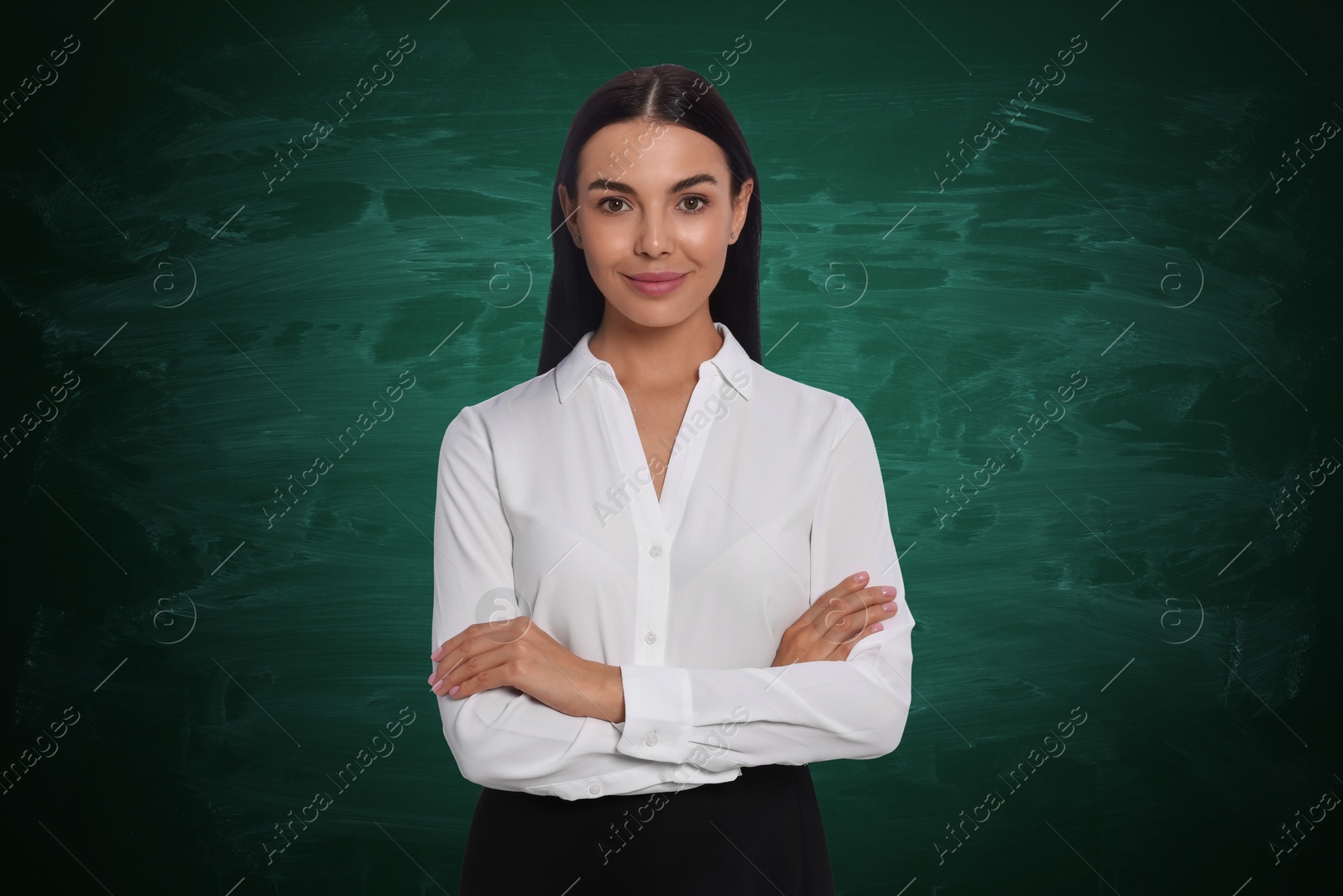 Image of Portrait of woman near green chalkboard. Teacher, business coach