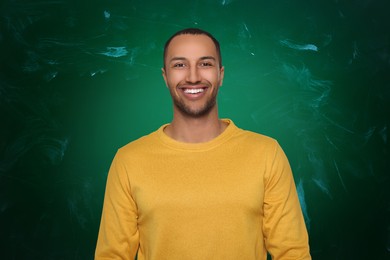 Image of Portrait of man near green chalkboard. Teacher, business coach