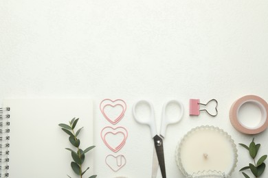 Photo of Paper clips, other stationery and green branches on white background, flat lay. Space for text