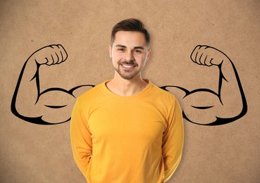 Image of Confident man with drawing of strong arms behind him on light brown background