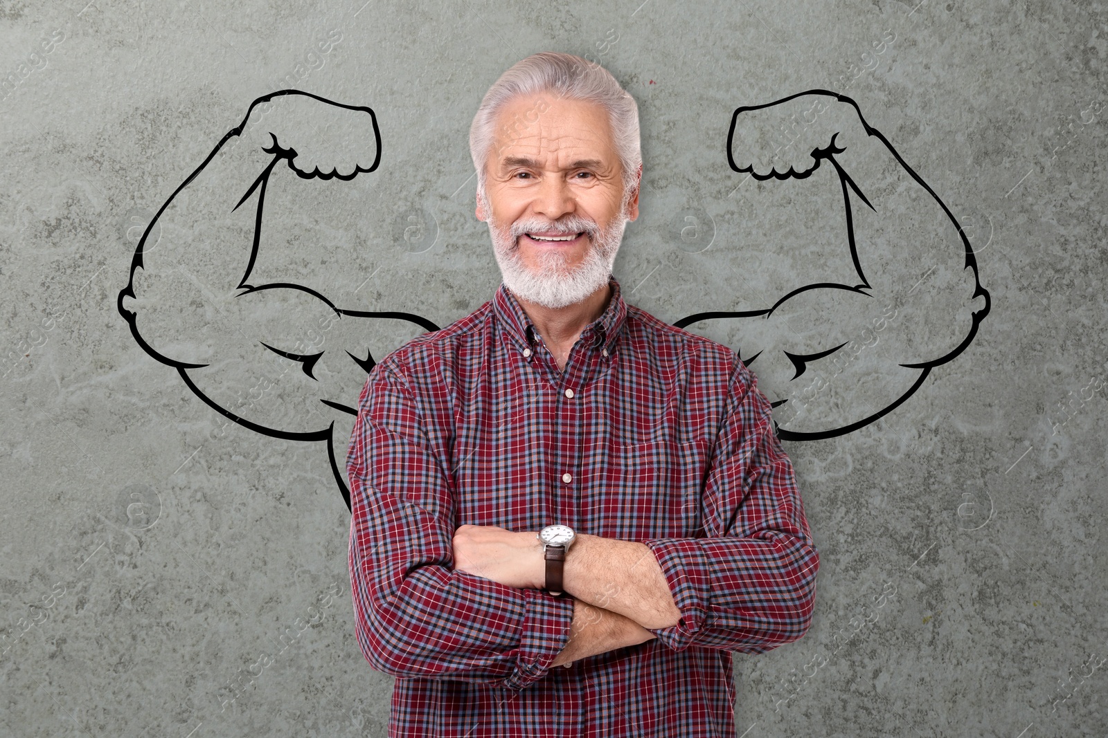 Image of Happy man with drawing of strong arms behind him on grey background