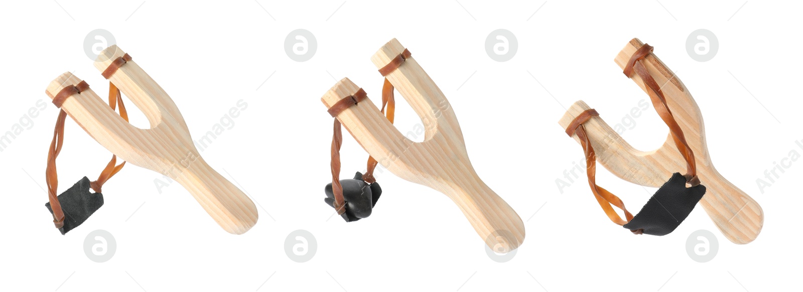 Image of Wooden slingshot with pebble on white background, set